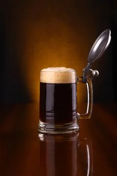 Mug of dark beer Stock Photos