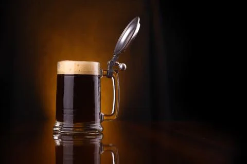 Mug of dark beer Stock Photos