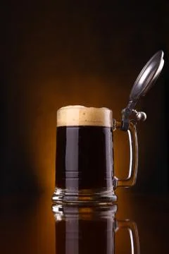 Mug of dark beer Stock Photos
