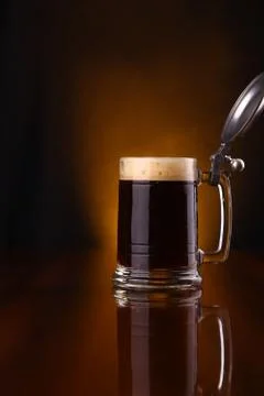 Mug of dark beer Stock Photos