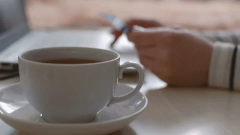Mug with drink in the foreground. Vídeos de archivo 104085030
