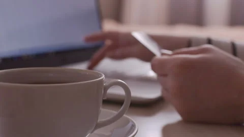 Mug with drink in the foreground. Stock-Footage 104085051