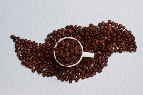 Mug full of coffee beans. Stock Photos