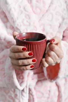Mug in hands Stock Photos