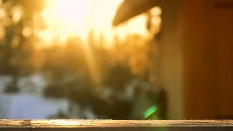 Mug with hot drink steaming under the sunlight in winter cold day Stock Footage 71982565