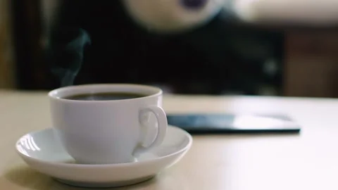 Mug of hot drink on the table. close-up. HD 動画素材 98655449