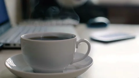 Mug of hot drink on the table. close-up. HD Video stock 98656434