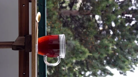 A mug of hot tea on balcony Stock Footage 154713016