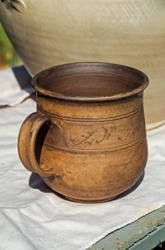 Mug made of clay Stock Photos
