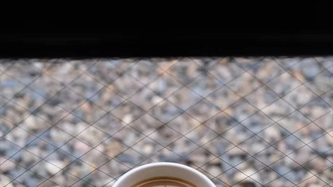A mug of milk coffee Stock Footage 100998588
