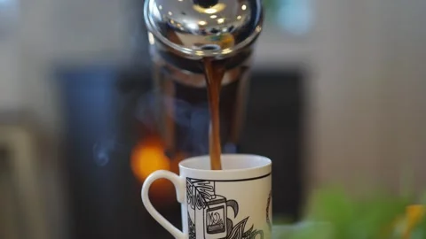 A mug with a picture of a fire and the letters B and G on it Stock Footage 295367698