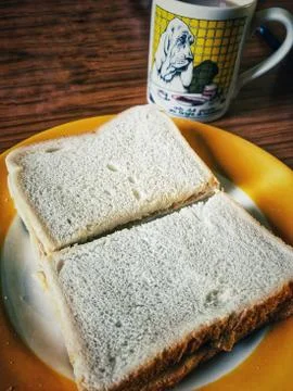 Mug of tea and a sandwich Stock Photos