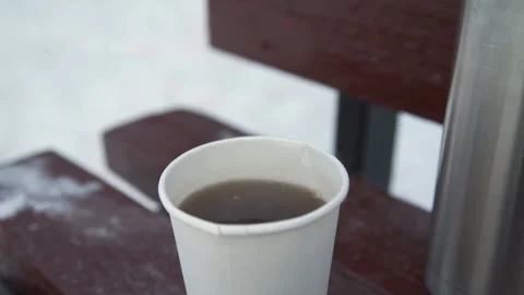 Mug with Tea is on the Bench in Winter Stock-Footage 101768307
