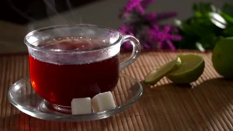 A mug of tea, pieces of sugar and lime Stock Footage 149145151