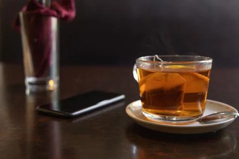 Mug of tea on the table in the cafe Stock Photos