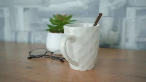 A mug of tea on the table Stock Footage 144181644