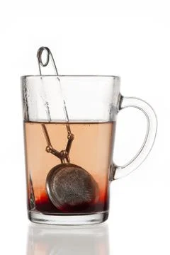 Mug of tea with tea infuser Stock Photos
