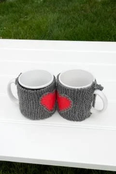 Mug warmer on a table in a garden Stock Photos