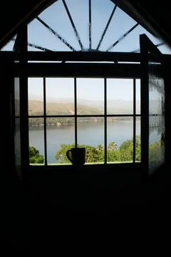 Mug at window Stock Photos