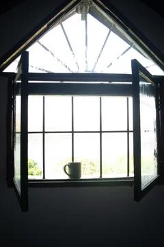 Mug at window Stock Photos