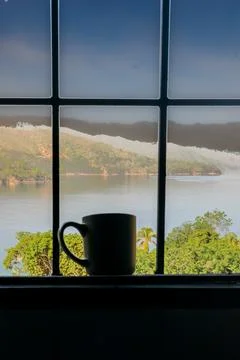 Mug at window Stock Photos