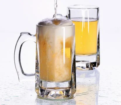 Mugs with beer Stock Photos