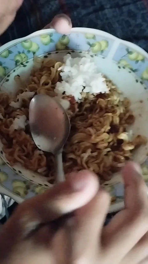Muha eats fried rice and noodles Stock Footage 211986824