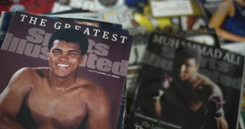 Muhammad Ali's death in 2016, honored by Sports Illustrated Special Edition. Stock Footage 146353553