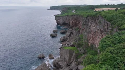 Muiga Cliffs - Wind Energy Windmills - Miyakojima - Okinawa - Japan - Forward Stock Footage 345368448