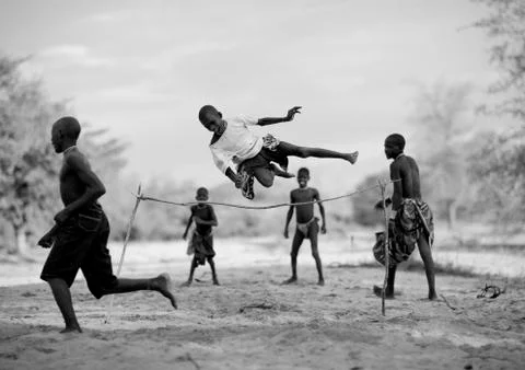 Mukubal Kids Doing High Jumping, Virie Area, Angola Stock Photos