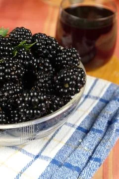 Mulberry on table with a juice Stock Photos