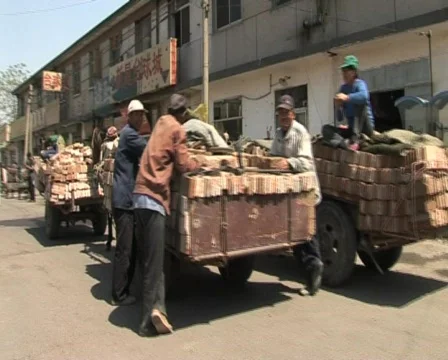   mules, bricks, guys and bikes china Stock Footage 285392