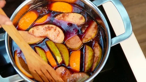 Mulled wine is boiling on the stove Stock Footage 78275958