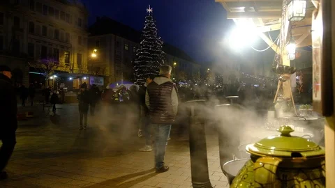 Mulled Wine Bubbling and Steaming at Xmas Market Stock Footage 121582908