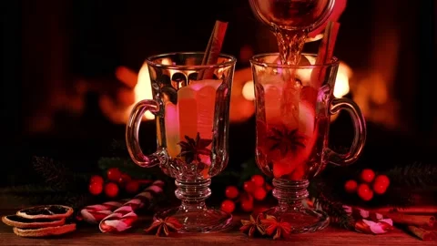 Mulled wine in glasses against the background of a fireplace fire Stock Footage 166792223