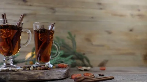 Mulled wine hot drink or tea with spices and spices on a wooden background with  Stock Footage 120121075