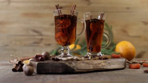 Mulled wine hot drink or tea with spices and spices on a wooden background with  Stock Footage 120121082