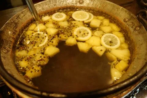 Mulled wine with lemon and pineapple Stock Photos