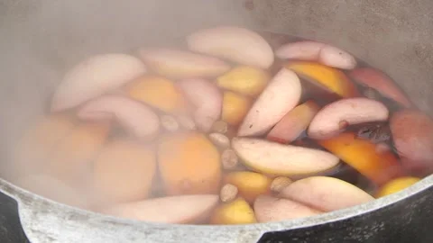 Mulled wine is prepared in the cauldron Stock Footage 104942771