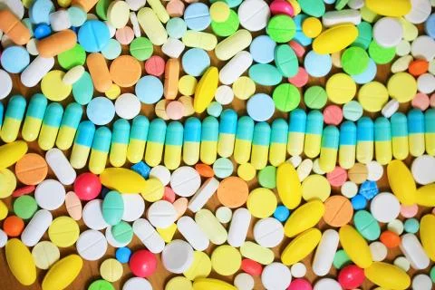 Multcolor pills background Stock Photos