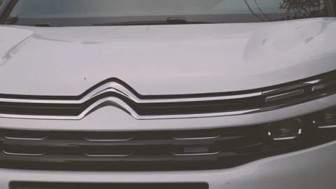 Multi-angle video of a white city SUV parked in the square Stock Footage 156942723