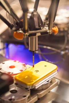 The multi-axis CMM machine measure the aluminum mobile phone part . Stock Photos