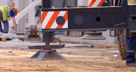 A multi-axle powerful mobile crane is preparing to lift a load Stock Footage 147638908