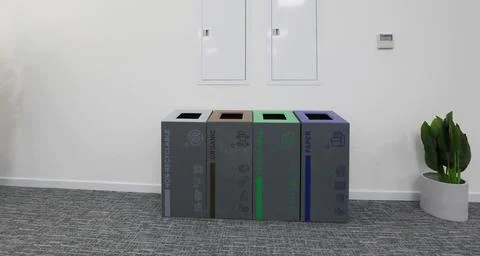 Multi-bin recycling bin in office Stock Photos