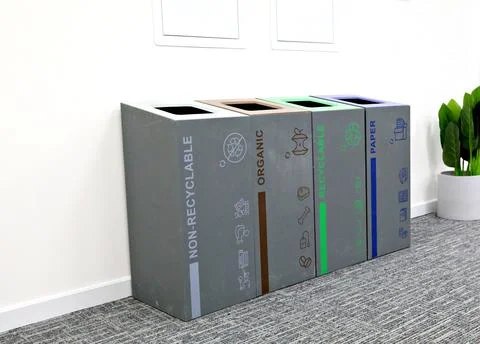 Multi-bin recycling bin in office Stock Photos