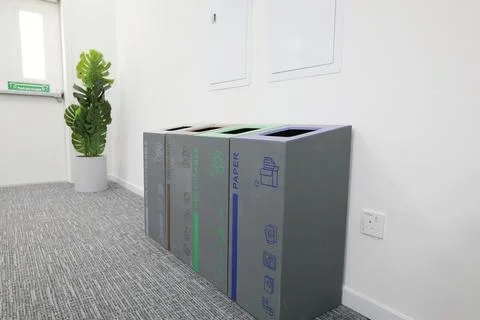 Multi-bin recycling bin in office Stock Photos