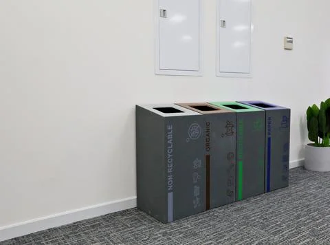Multi-bin recycling bin in office Stock Photos