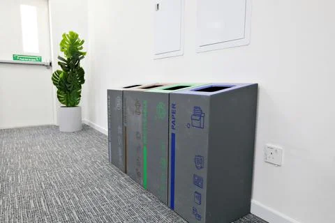 Multi-bin recycling bin in office Stock Photos