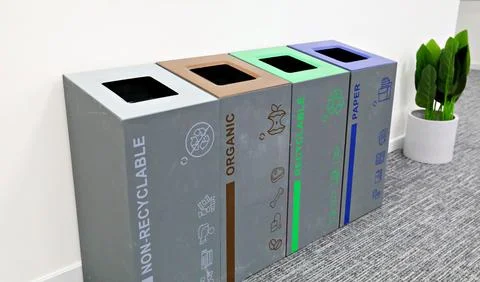 Multi-bin recycling bin in office Stock Photos