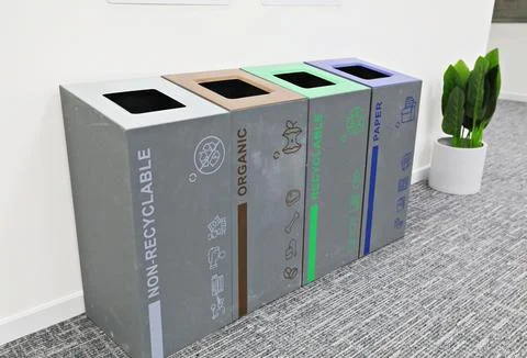 Multi-bin recycling bin in office Stock Photos